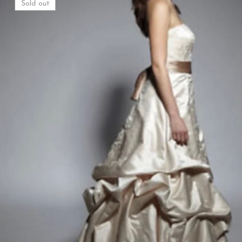 Oleg Cassini champagne with beige sash elegant ruffle and train.